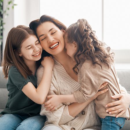 Hands holding an animated tooth and umbrella