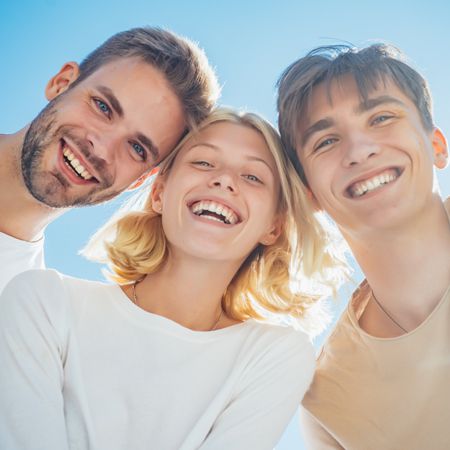Hands holding an animated tooth and umbrella